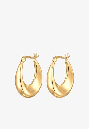 Boucles d'oreilles créoles en métal doré avec une forme lisse et arrondie et une finition brillante. Présentent un détail fait à la main unique en haut pour le maintien.
