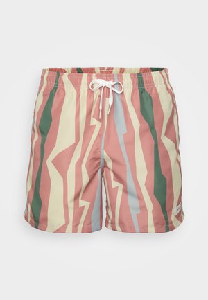 Shorts de bain avec un motif zigzag multicolore en rose, vert et bleu, fabriqués en tissu léger, avec une taille élastique et un cordon de serrage.