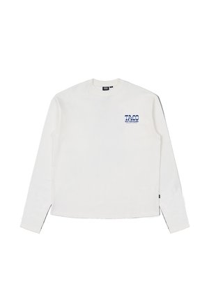 White long-sleeve shirt made of cotton. Features a blue graphic print on the left chest area. Classic crew neck and straight hem.