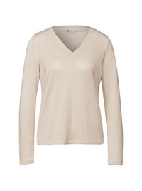 Beige långärmad topp med V-ringning. Tillverkad av ett texturerat stickat tyg med en subtil glans. Standard passform med rak fåll.
