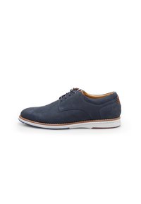 Navy suede lace-up shoe with a rounded toe, light brown accent at the heel, and white sole with red and blue details. Textured upper.
