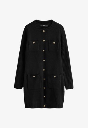 Fekete kardigán arany gombokkal, bordázott ujjakra és két elülső rakásolt zsebbel. Puha, textúrált anyagból készült. Klasszikus dizájn.