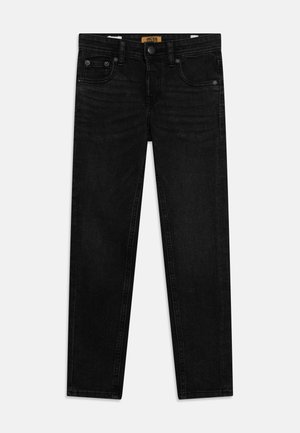 Mustadest denimist valmistatud slim fit teksad, millel on viis taskut, metallist nööp ja kontrastsete õmblustega detailid. 