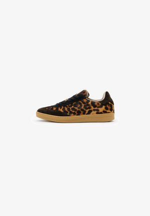 Low-top sneaker with leopard print fabric, black suede accents, black laces, and a tan rubber sole, shown from the side on white background.