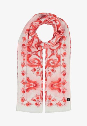 White scarf with intricate red floral and ornamental patterns, loosely looped at the top, featuring a small black brand tag at the bottom edge.