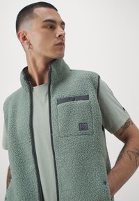 Didriksons VEST UNISEX - Waistcoat - light moss