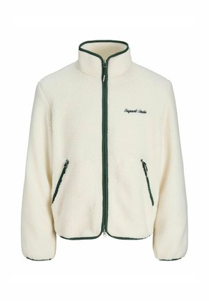 Valge fliisjakk kõrge kraega, rohelise tõmbluku ja äärega, kahe tõmblukuga küljetaskuga ning "Original Studio" tikandiga.