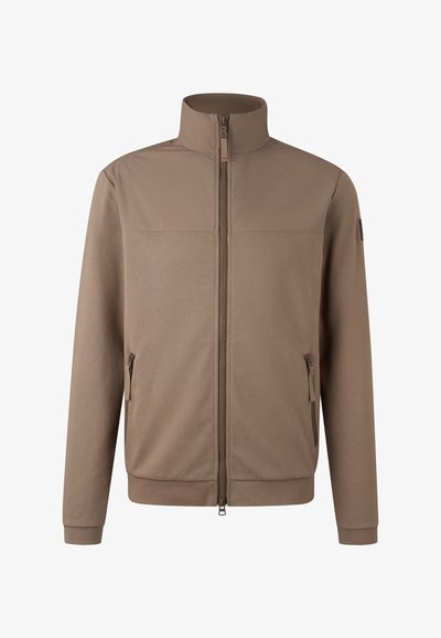 Brun lynlåsjakke med ståkrave, lavet af blød, tekstureret stof. Har to sidelommer og minimalistiske design detaljer.