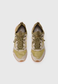 Beige and olive mesh sneakers with textured suede accents, featuring round laces, eyelets, and a rubber sole. Top view perspective.