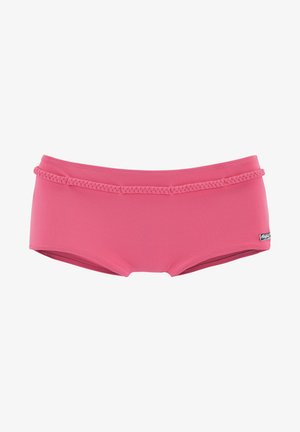 Pink swim shorts made of stretchy fabric, featuring a braided waistband, a solid color design, and a tag on the side.