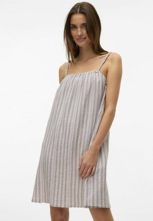 Robe tank légère en tissu rayé, dotée de fines bretelles, d'une coupe ample et d'une longueur mi-cuisse avec de subtiles variations de texture.