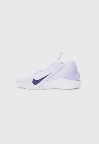Light purple athletic shoe with a textured mesh upper, curved heel, and dark purple swoosh logo. Features lacing and a pull tab at the back.