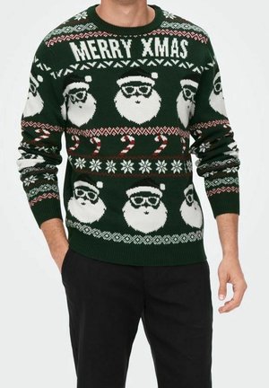 Maglione verde a maglia con volti di Babbo Natale bianchi con occhiali, bastoncini di zucchero, fiocchi di neve e il testo "MERRY XMAS" in un motivo festivo.