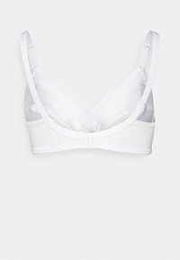 Vit bh med mjuka, genomskinliga kupor, justerbara band och en slät underdel. Har en klassisk design och en minimalistisk struktur.