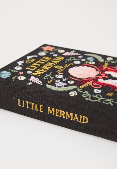 Black fabric book cover featuring colorful embroidery of seashells and marine motifs, with "The Little Mermaid" in gold lettering.