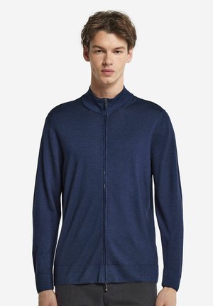 Marineblauer Reißverschluss-Pullover aus weichem Strickmaterial, mit hohem Kragen, langen Ärmeln und einer schlanken Passform. Glatte Textur mit minimalistischen Design.