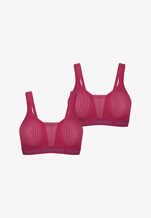 Sujetadores deportivos rosas con diseño perforado, tirantes anchos y una banda elástica suave con el nombre de la marca "triAction". Material ligero y transpirable.