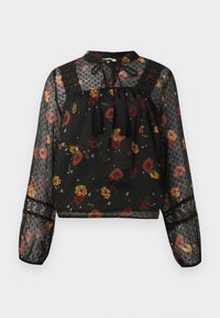 Blusa nera trasparente a maniche lunghe con motivo floreale multicolore, dettagli in pizzo, texture a pois e collo con nastro a nappina legato.