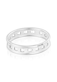 Anello a fascia in argento con sagome di orso ritagliate e distribuite uniformemente lungo la circonferenza, con la marcatura "TOUS S925" sul lato interno.