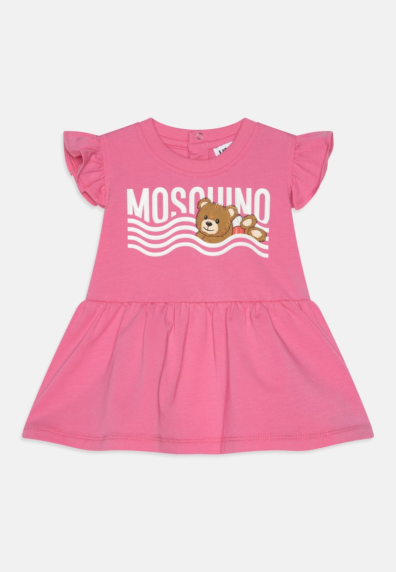 Pink cotton dress with short ruffled sleeves, featuring "MOSCHINO" text and an embroidered bear design above wavy lines.