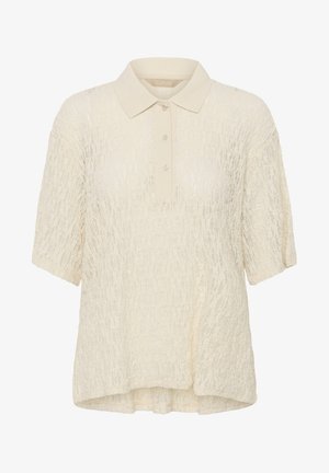 Kreemikas lühikeste varrukatega polosärk tekstuurse kangaga ja kolmekordse nööpidega plaketiga.