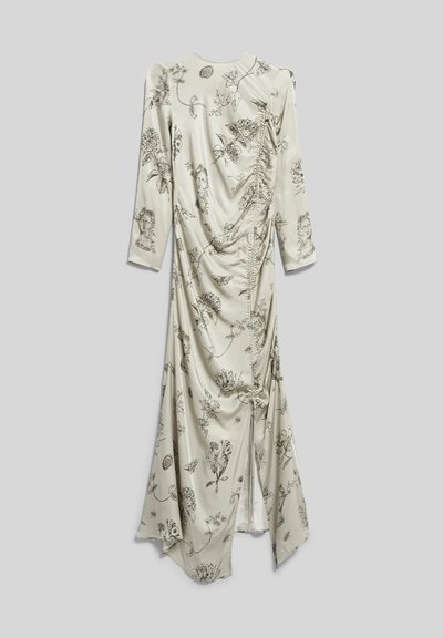 Robe longue crème avec croquis noirs floraux et de visages, manches longues, détail froncé sur le devant et ourlet asymétrique.