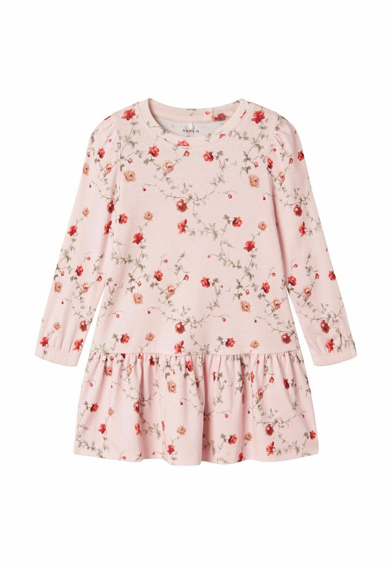 Robe rose à manches longues avec motif floral, taille froncée et jupe à volants. Tissu doux avec un léger brillant, encolure arrondie et poignets élastiques.