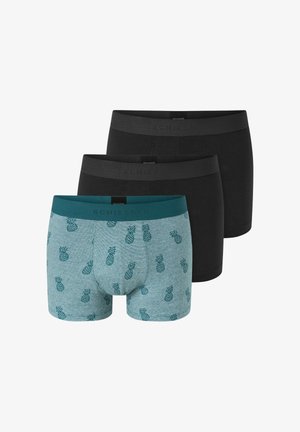 Trzy pary męskich bokserek: jedna w kolorze jeansowym z zielonym wzorem ananasa, dwie w jednolitym czarnym kolorze. Wszystkie mają elastyczne pasy z logo.