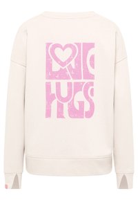 Lichtbeige sweatshirt met een gestructureerde roze graphic met de tekst "LOVE HUGS." Voorzien van een ronde halslijn en gesplitste manchetten. Zachte stoftextuur.