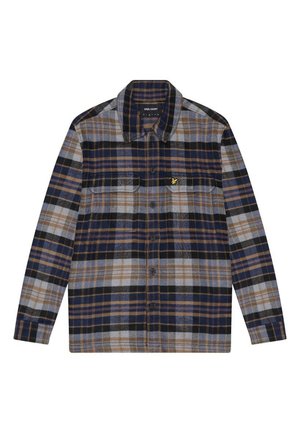 Chemise en flanelle à carreaux bleu, gris et marron. Caractéristiques : fermeture à boutons sur le devant, col, et deux poches sur la poitrine. Détail du logo jaune.