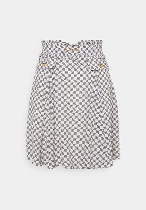 White skirt with black geometric pattern, gathered waistband, two front pockets with gold buttons, and pleated design for added texture.