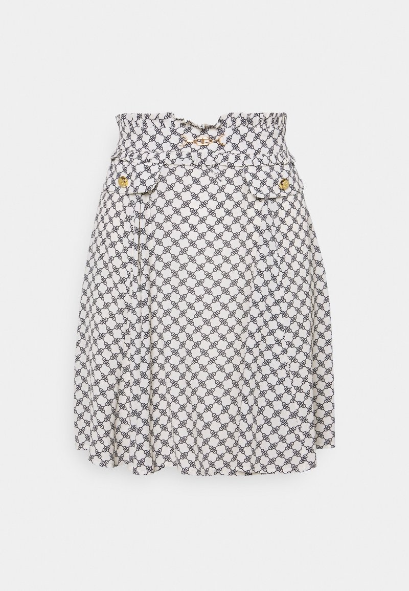 Jupe blanche avec motif géométrique noir, taille froncée, deux poches avant avec boutons dorés, et design plissé pour ajouter de la texture.