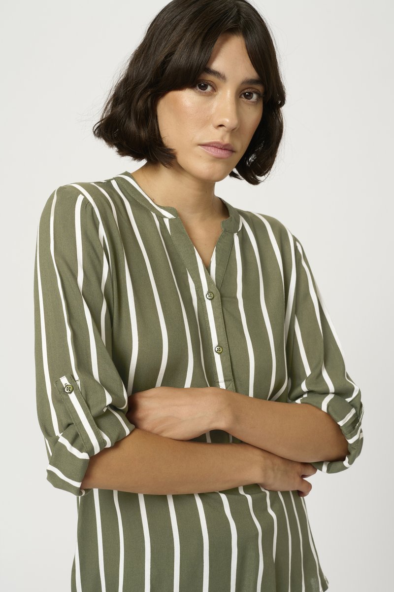 Green striped blouse made of lightweight fabric. Features a buttoned placket and rolled-up sleeves with button accents.