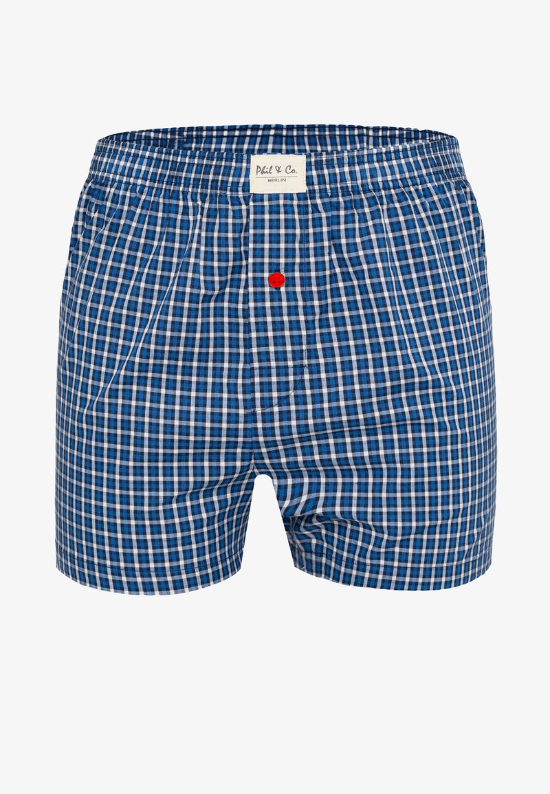 Męskie bokserki w niebiesko-biało-czarną kratę z elastycznym pasem, czerwonym guzikiem przy kroku oraz białą metką "Phil & Co. Berlin".