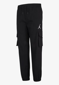 Pantalon cargo noir avec taille et poignets élastiques, poche latérale zippée, poches cargo à rabat et logo Jumpman blanc sur la cuisse droite.