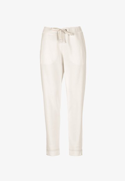 Pantalon écru fuselé avec taille élastique, poches avant, fermeture par cordon de serrage et ourlets retroussés.