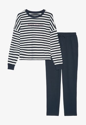 Laivastonsininen ja valkoinen raidallinen pitkähiha toppi, jossa logo, sekä yhteensopivat laivastonsiniset housut, joissa on joustava vyötärö ja kiristysnauha. Pehmeä kangas, rento malli.