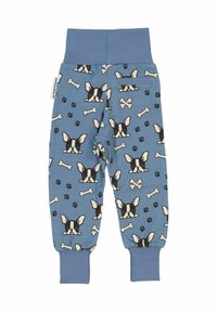 Blå pyjamasbyxor med ett mönster av franska bulldoggar, ben och tassavtryck. Mjuk tyg med ribbade muddar och midjeband.