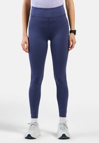 Leggings de sport taille haute, bleu marine, avec une texture lisse. Présente un logo discret et une coupe ajustée pour le confort et la flexibilité.