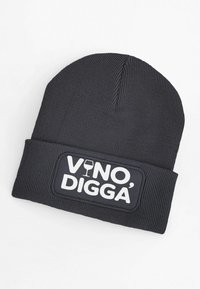 Black knit beanie with a ribbed texture. Features a rectangular patch with "VINO, DIGGA'" in white text and a wine glass icon.