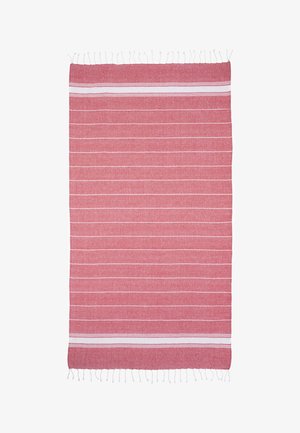 Red rectangular textile with thin white horizontal stripes and white fringe on short edges.