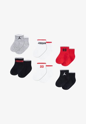 Set of six baby socks in gray, black, white, and red. Features include ribbed cuffs and brand logos; varying lengths and color accents.