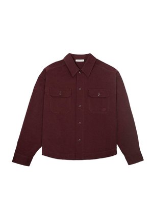 Men’s long-sleeve maroon button-up shirt with two front buttoned chest pockets and a pointed collar.
