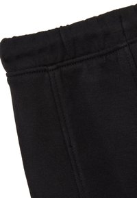 Schwarze Sporthosen mit einem weichen, dehnbaren Taillenbund und glattem Stoff. Nahtdetails verlaufen entlang der Beine.