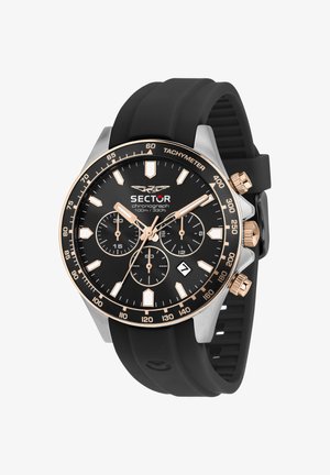 Orologio cronografo nero con dettagli in oro rosa, lunetta tachimetrica, tre quadranti ausiliari, finestra della data e cinturino in silicone nero, resistente all'acqua fino a 100 metri.