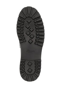 Zwarte rubberen schoenzool met een diep loopprofiel, voorzien van verschillende vormen en groeven voor grip. De merknaam "Sioux" is zichtbaar.