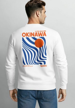 White sweatshirt featuring a colorful graphic on the back. Design includes wavy blue lines and a red circle, with "OKINAWA" in bold orange.