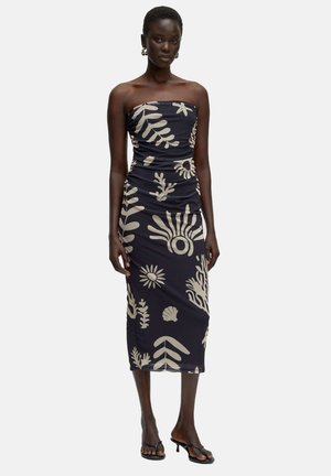 Navy strapless dress with beige floral and leaf patterns, featuring a fitted silhouette and ruched detailing throughout.