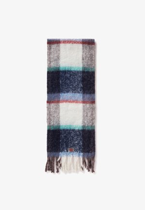 Szalik w kratę wykonany z mieszanki wełny, w przeważającej części biały, szary i granatowy, z akcentami w kolorze turkusowym i czerwonym. Miękka tekstura i frędzle na końcach.