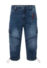 Denim half pants in dark blue with zigzag stitching, side pockets, and red zipper detail. Cinched ankles with elastic drawstrings.